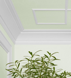Plan rapproché d'un coin du mur et du plafond de couleur vert clair avec cadrage blanc