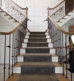 Split staircase with curved handrails